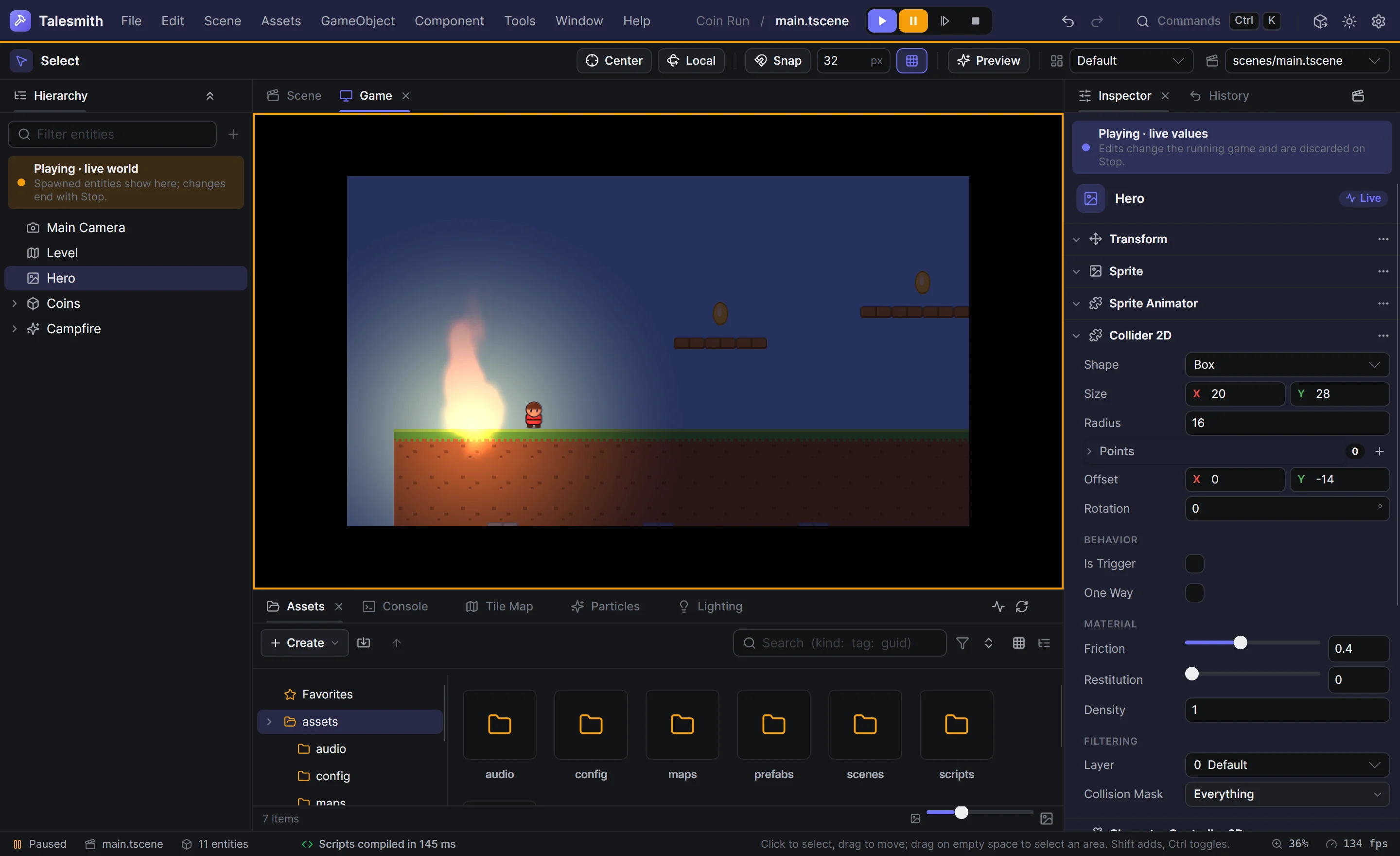 Play mode paused: the app bar's strip and the Game panel's frame in amber, the hero's live values in the inspector